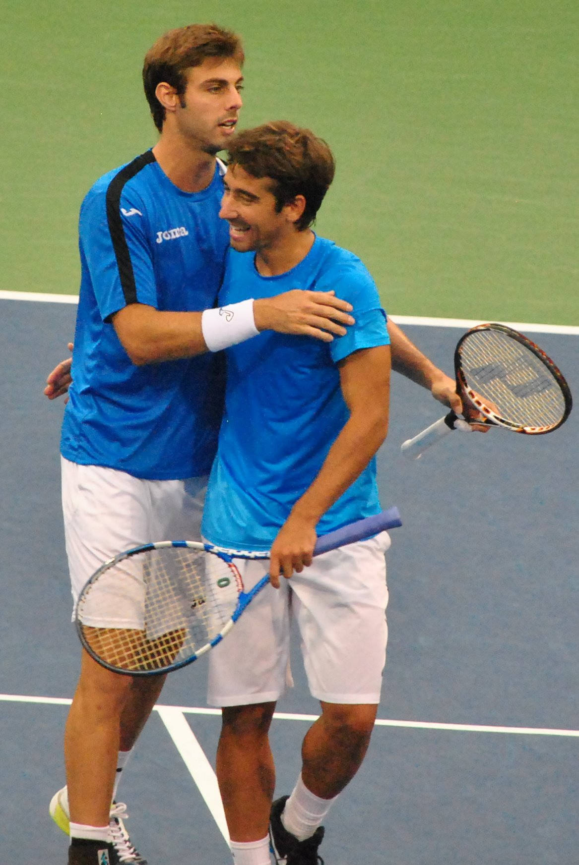 Marcel Granollers Hugging Marc López Background