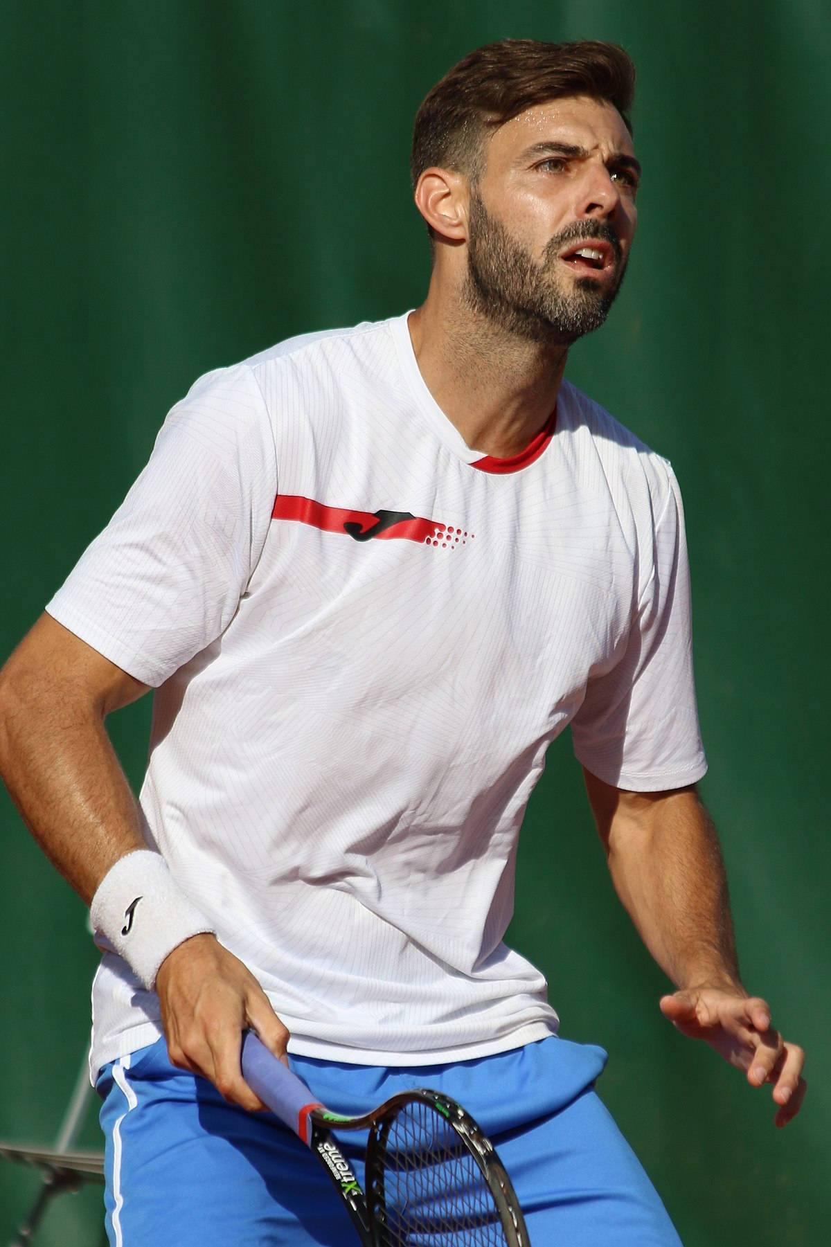 Marcel Granollers In White Shirt Background