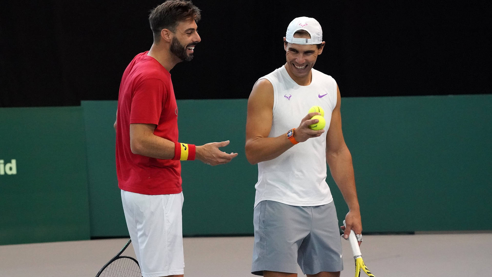 Marcel Granollers Laughing With Rafael Nadal Background