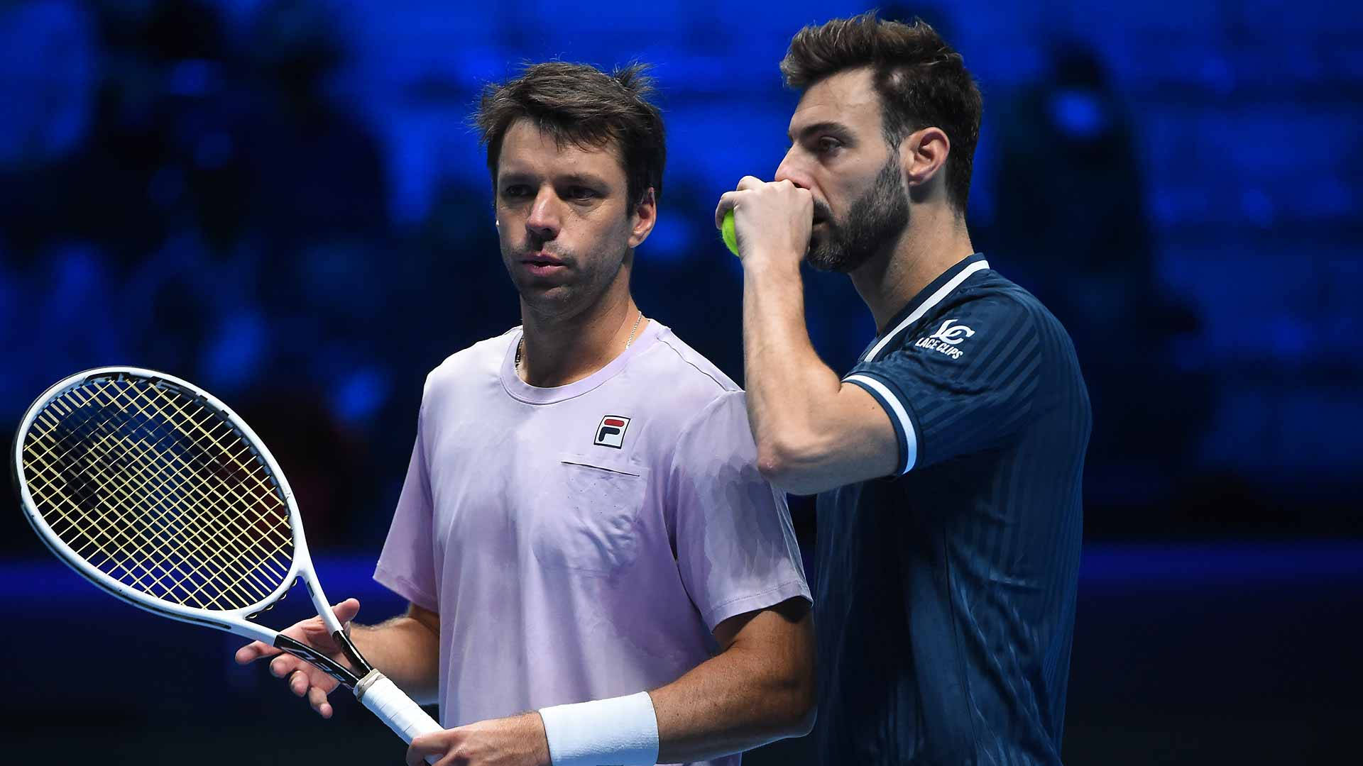 Marcel Granollers Talking To Horacio Zeballos Background