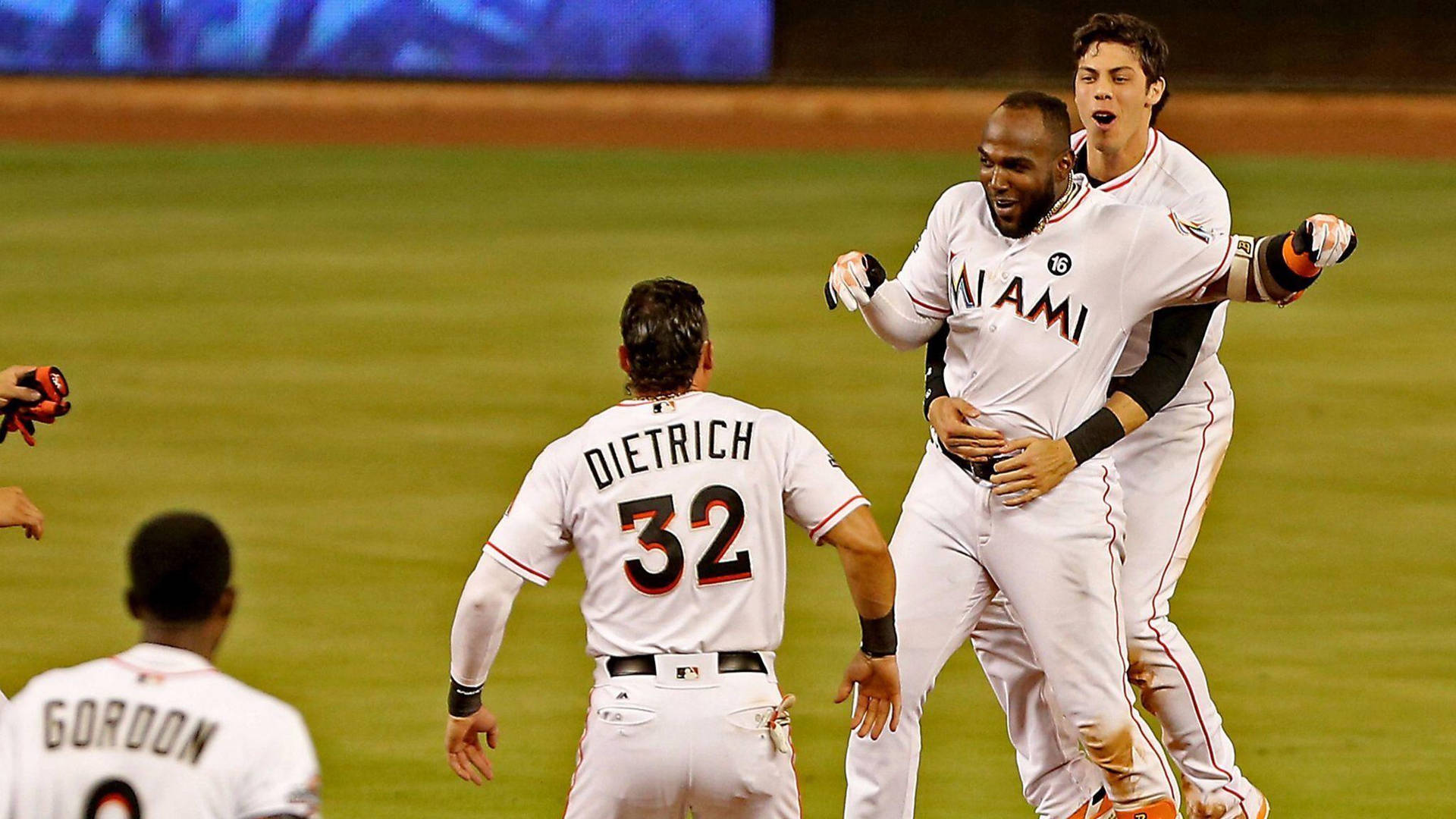 Marcell Ozuna Hugged By Teammate