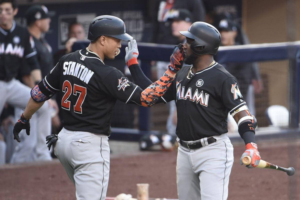 Marcell Ozuna Tapping Shoulders With Stanton