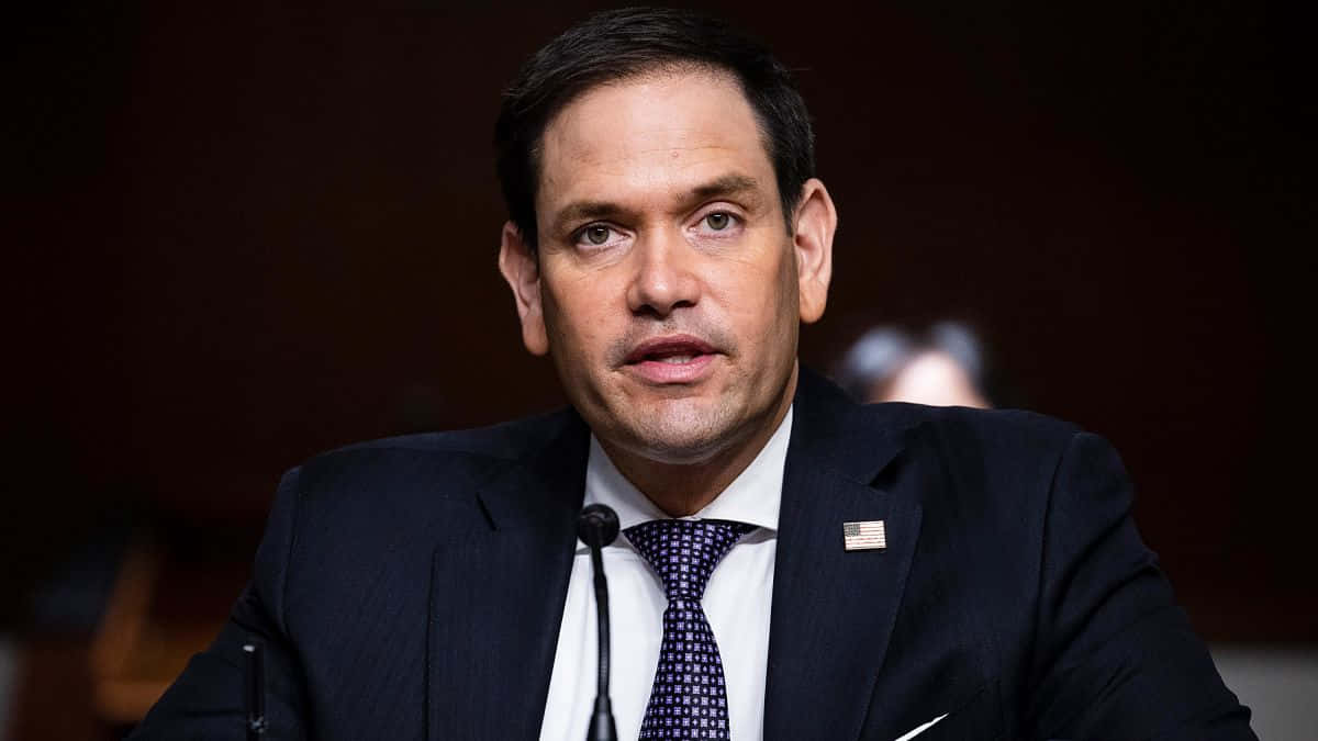 Marco Rubio In A Suit Background