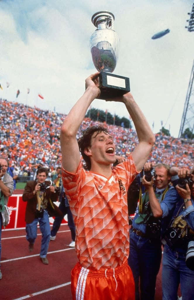 Marco Van Basten Happily Lifting Trophy Background