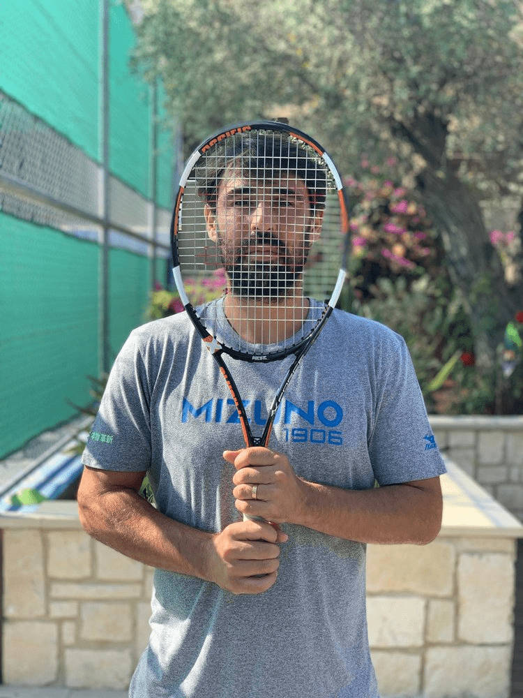 Marcos Baghdatis Behind Racket Background