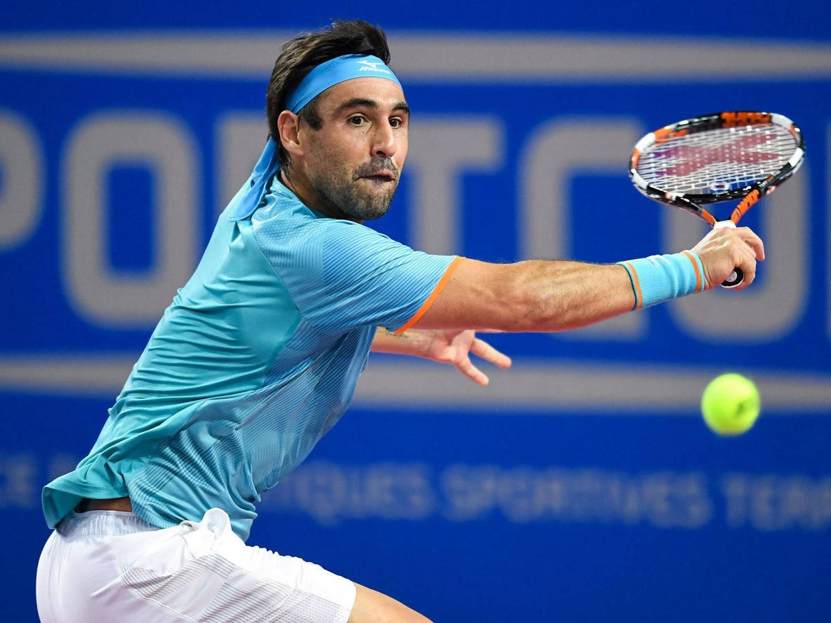 Marcos Baghdatis In Action On The Tennis Court Background