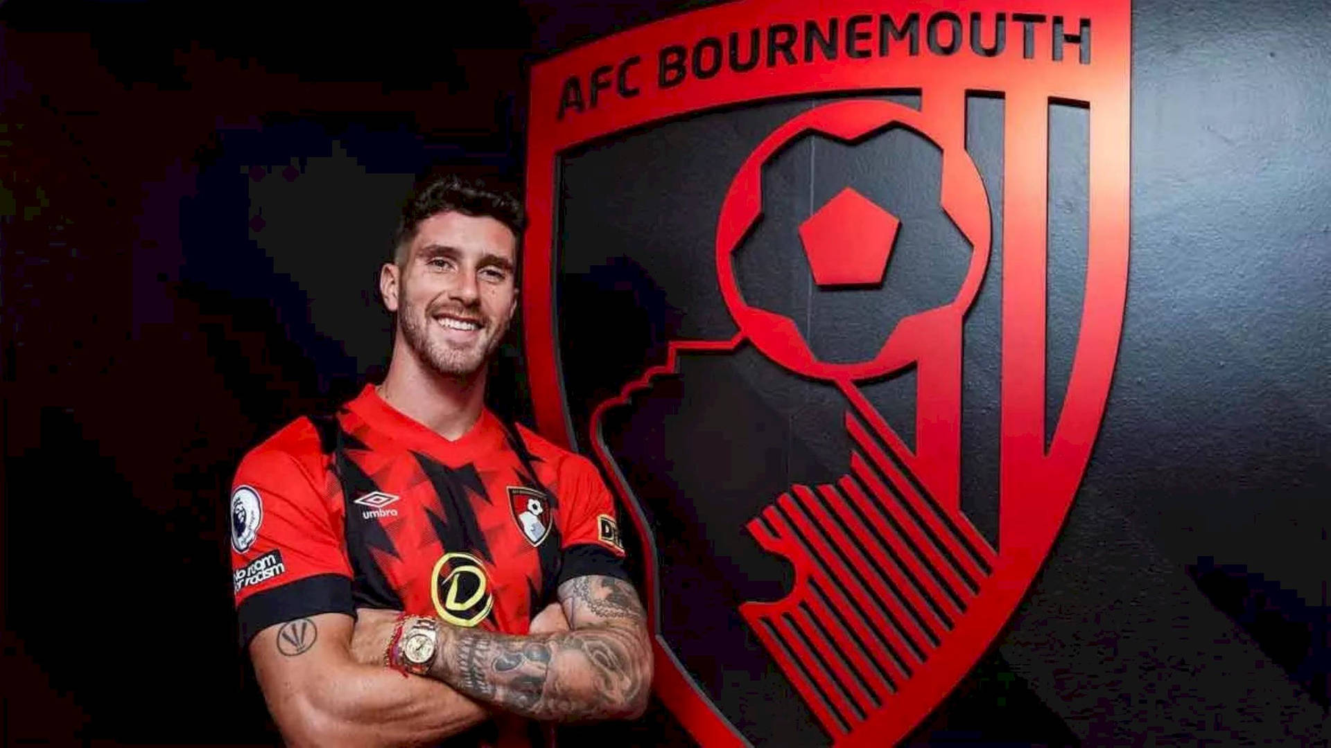 Marcos Senesi With Afc Bournemouth Logo Background