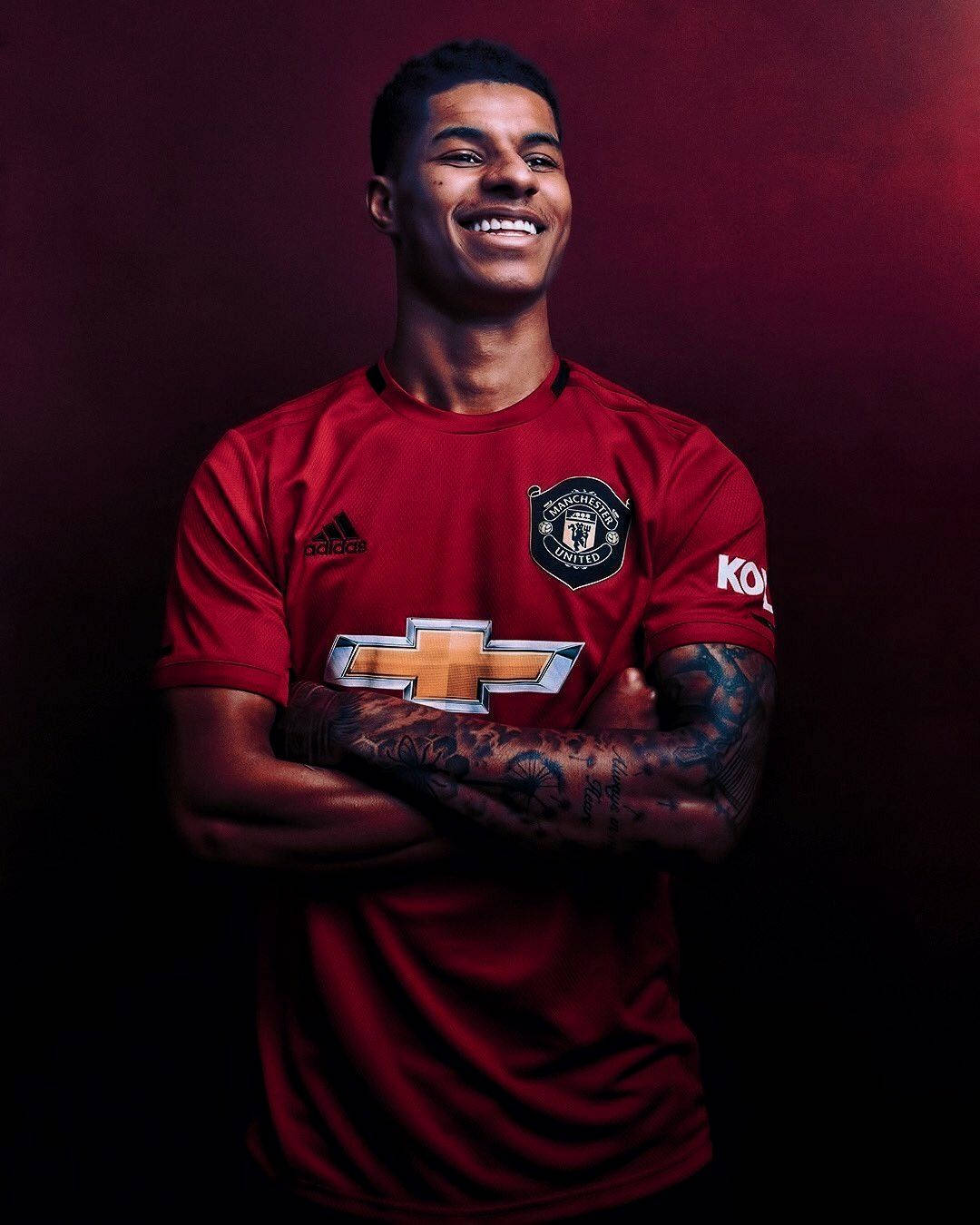 Marcus Rashford Crossed Arms Smiling Background