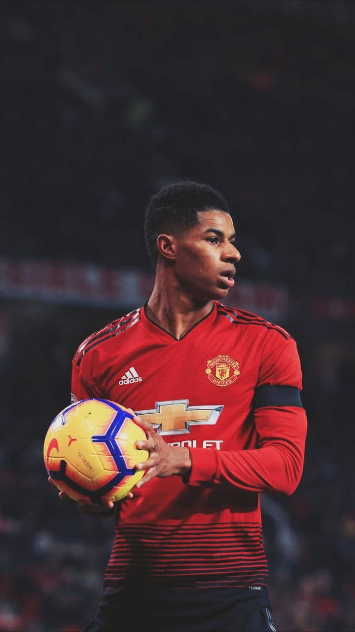 Marcus Rashford Holding Ball Background