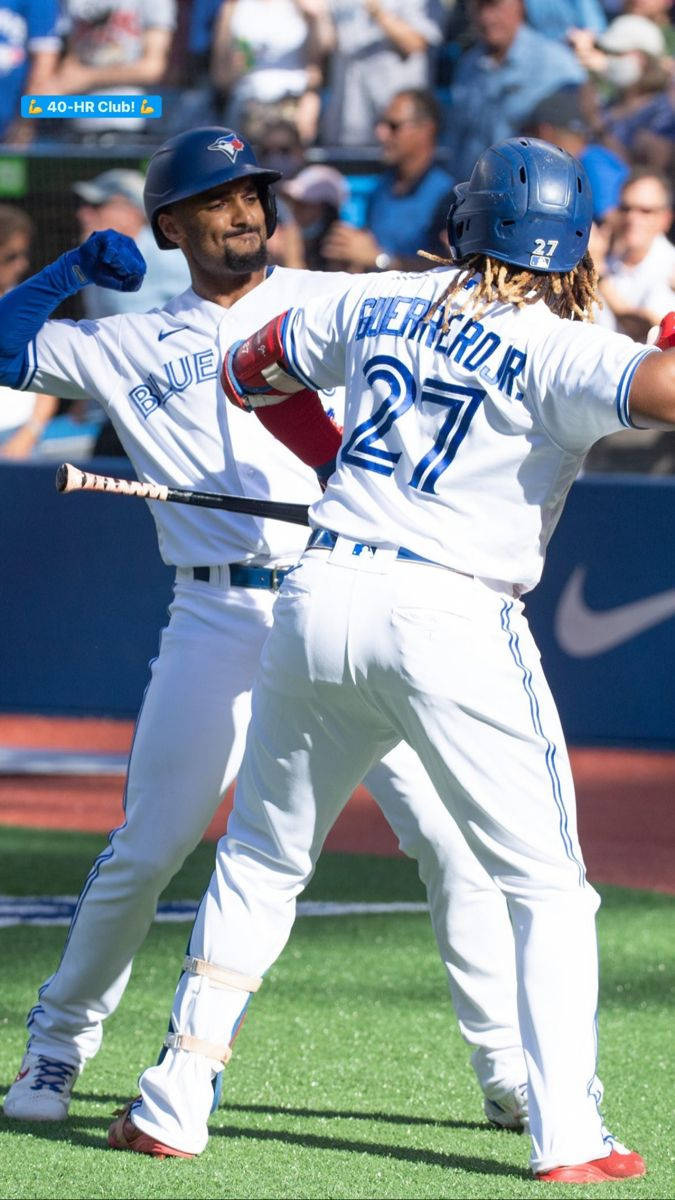 Marcus Semien Fist Bump With Guerrero Background