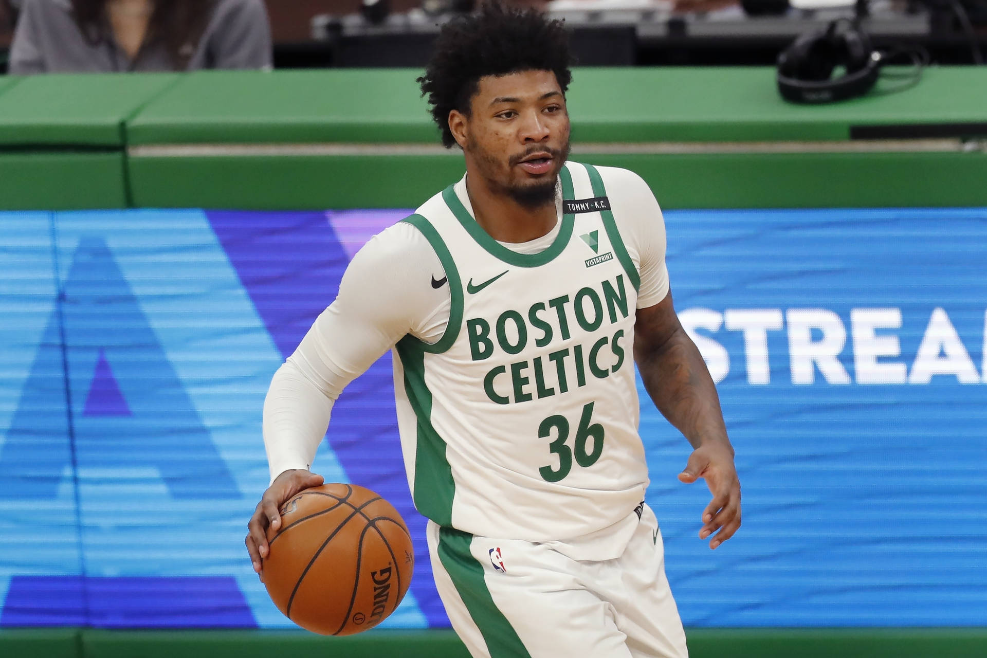 Marcus Smart Doing Tricks During Game Background