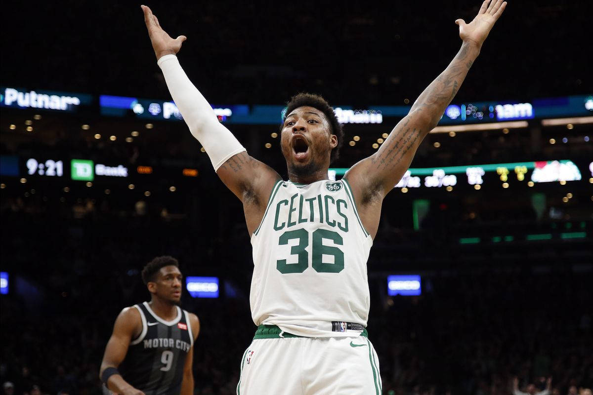 Marcus Smart Roars During Intense Game Background