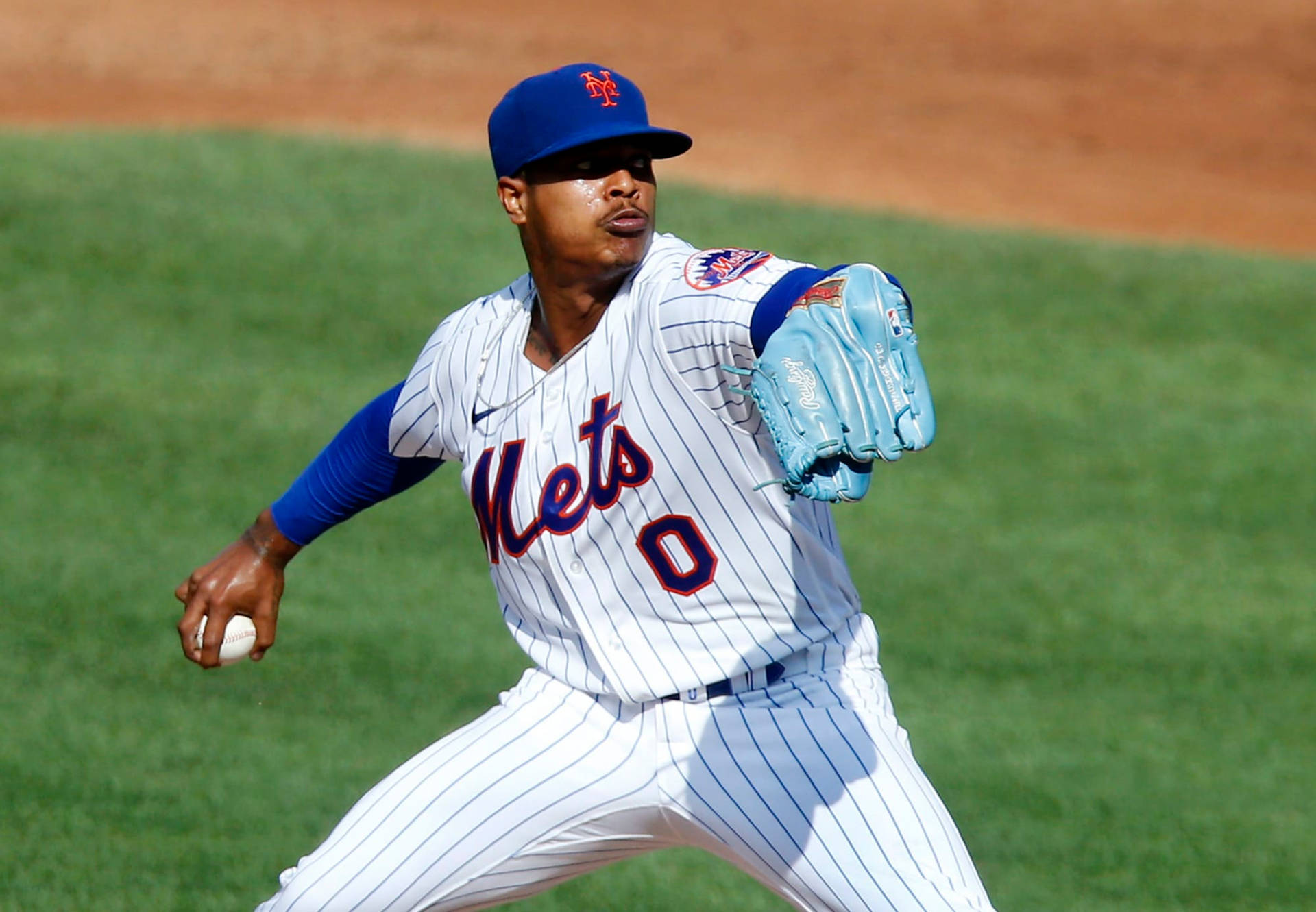 Marcus Stroman With Blue Baseball Mitt Background