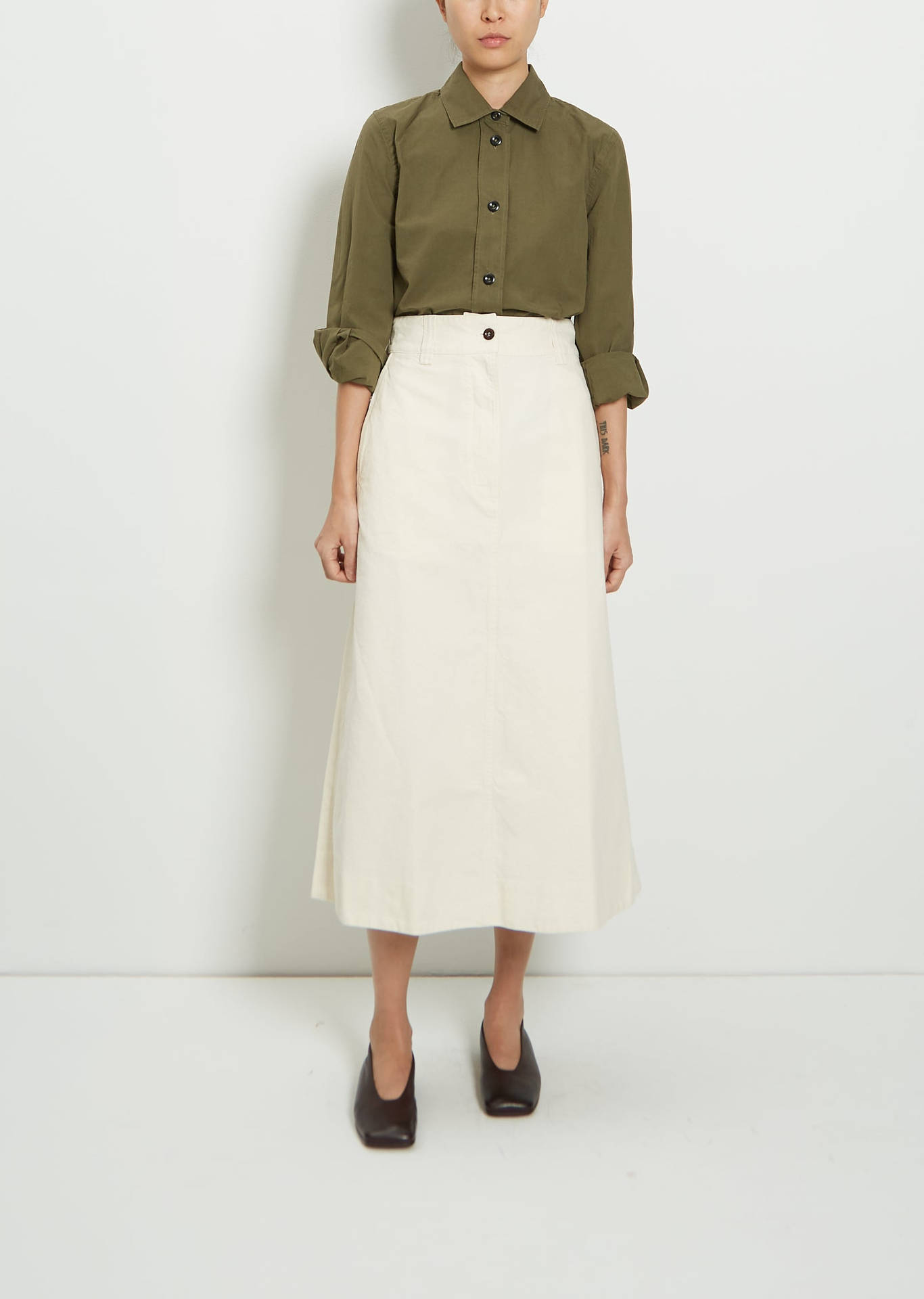 Margaret Howell Green Polo White Skirt Background