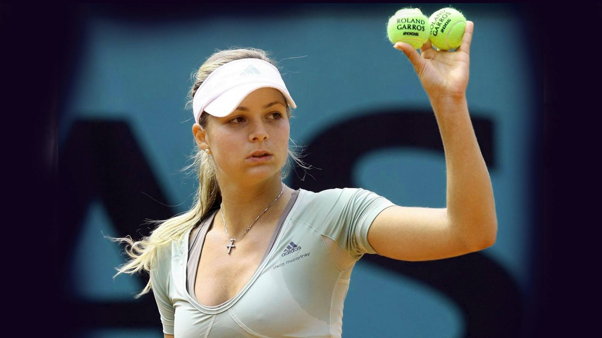 Maria Kirilenko In Action With Two Tennis Balls