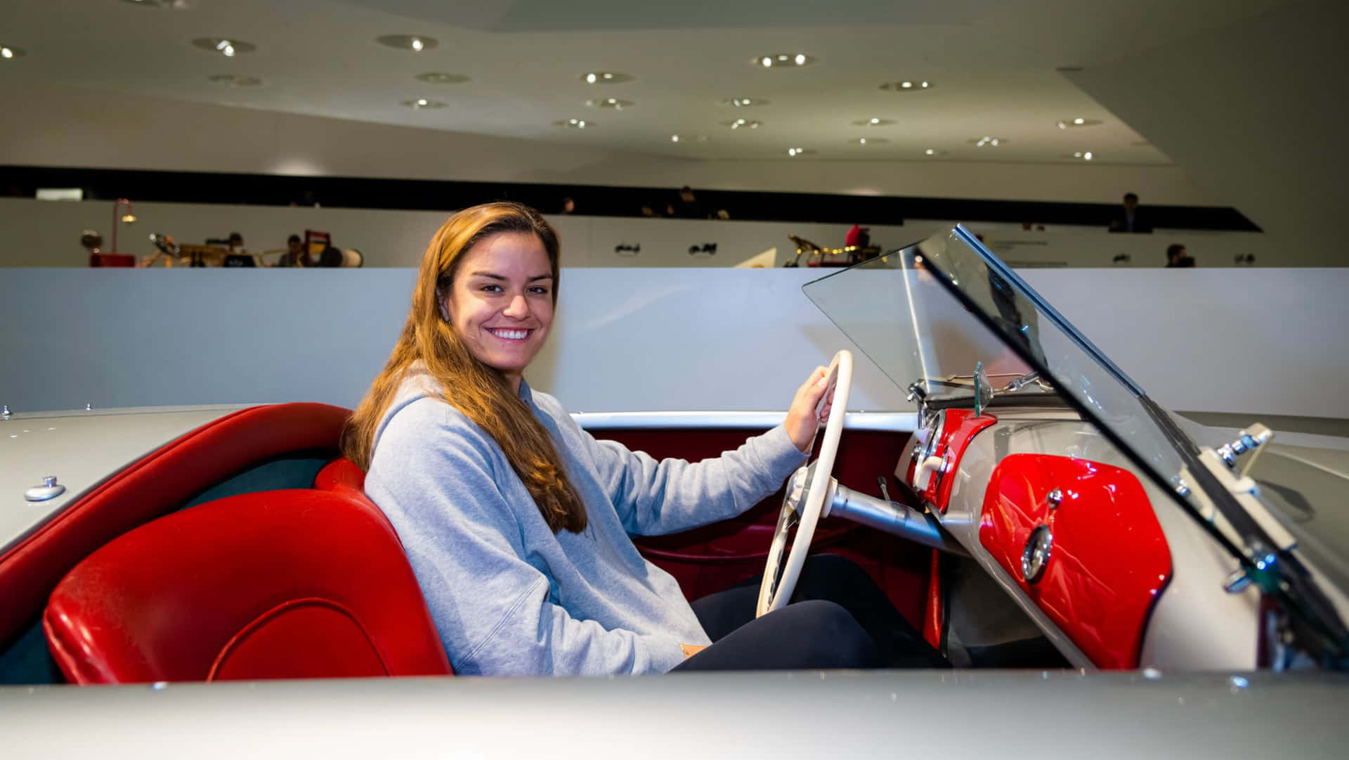 Maria Sakkari Driving A Convertible Background