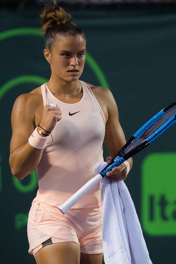 Maria Sakkari Holding Blue Racket Background