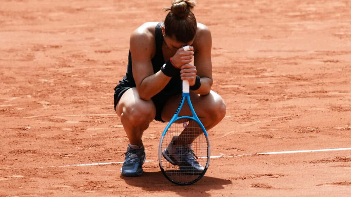 Maria Sakkari In Action During A Tennis Match. Background