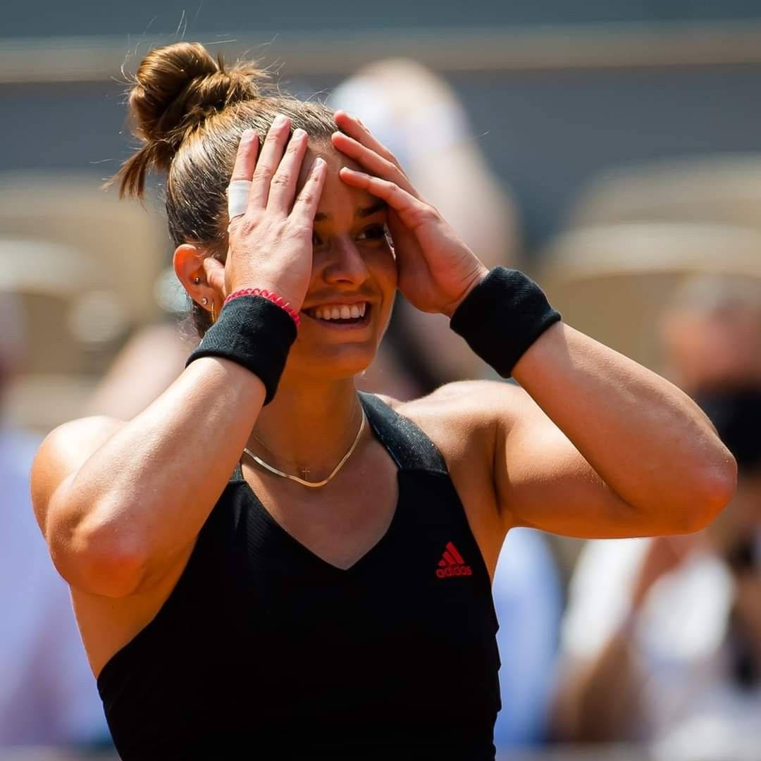 Maria Sakkari In Emotional Moment On Tennis Court Background