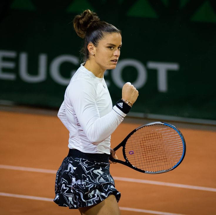 Maria Sakkari Practicing On Tennis Court Background