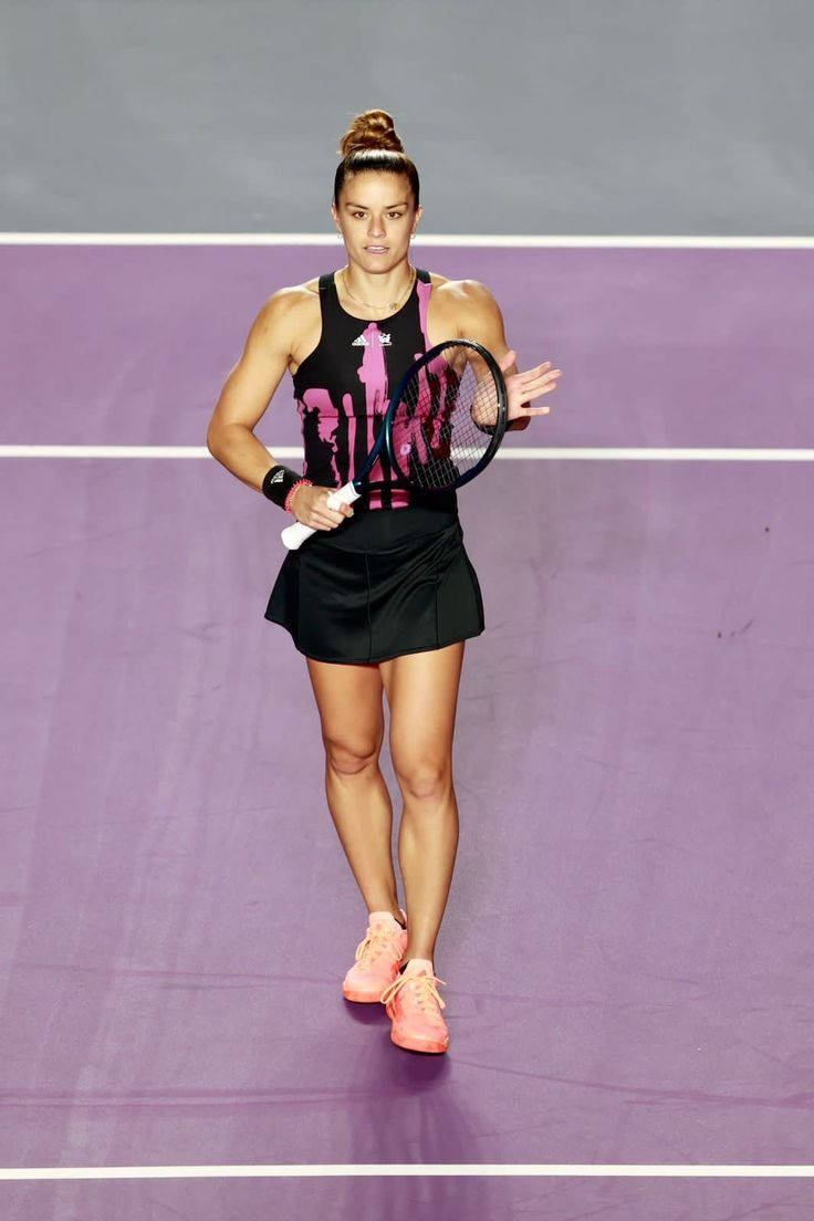 Maria Sakkari Walking On Court Background