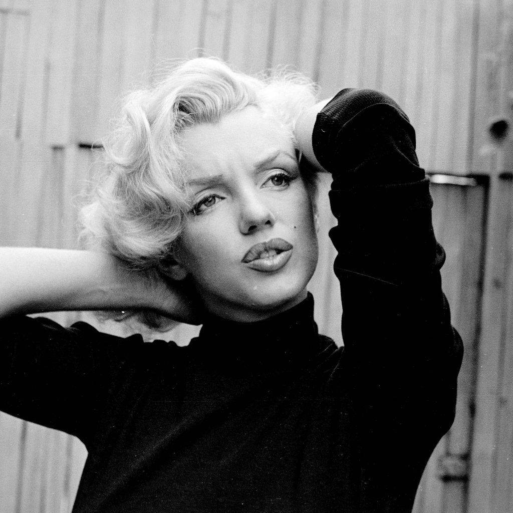Marilyn Monroe Arms On Head Background