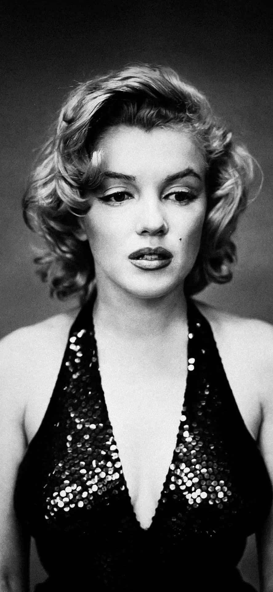 Marilyn Monroe Posing In Her Iconic Look On Iphone. Background