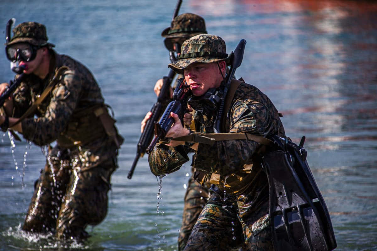 Marines In Camouflage Walking Through Water