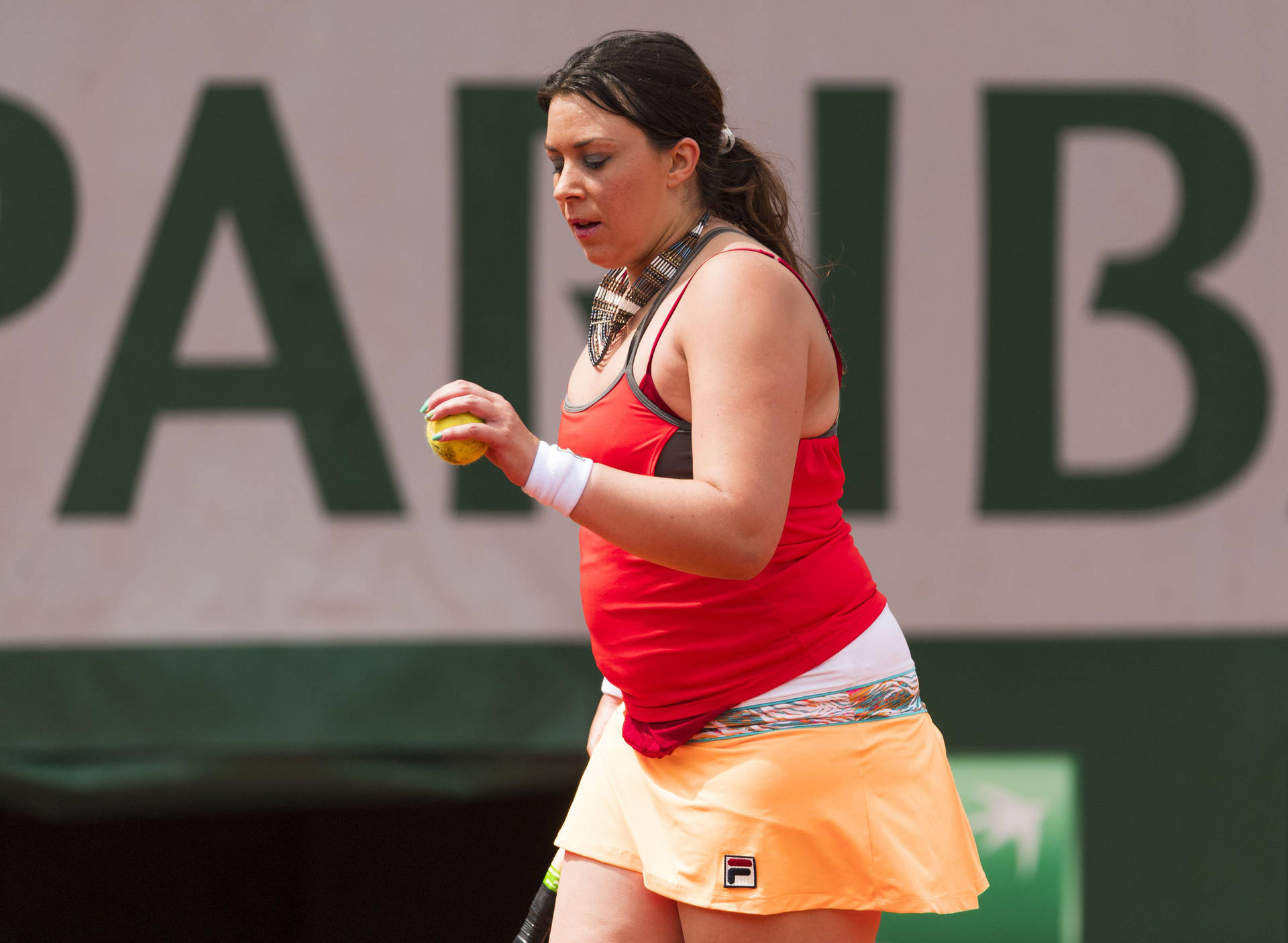 Marion Bartoli Shimmering In A Vibrant Red And Orange Tennis Outfit.