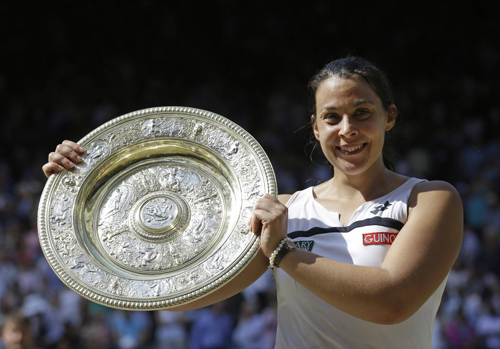 Marion Bartoli Triumphantly Lifting Her Wimbledon Trophy