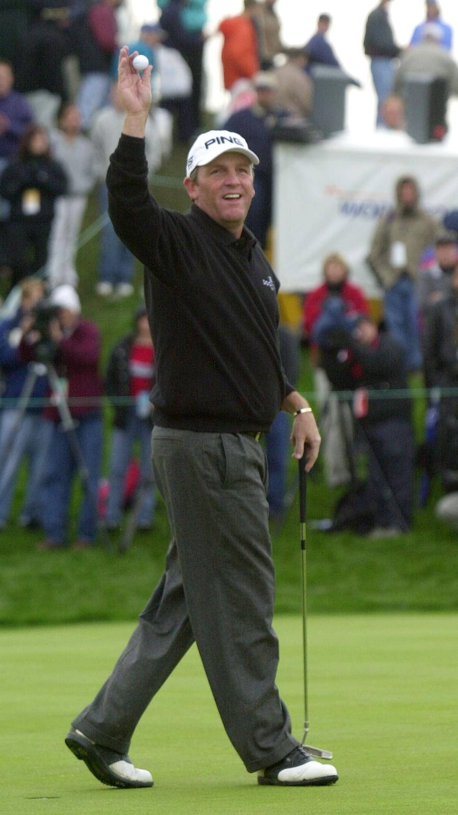 Mark Calcavecchia Raising A Golf Ball Background