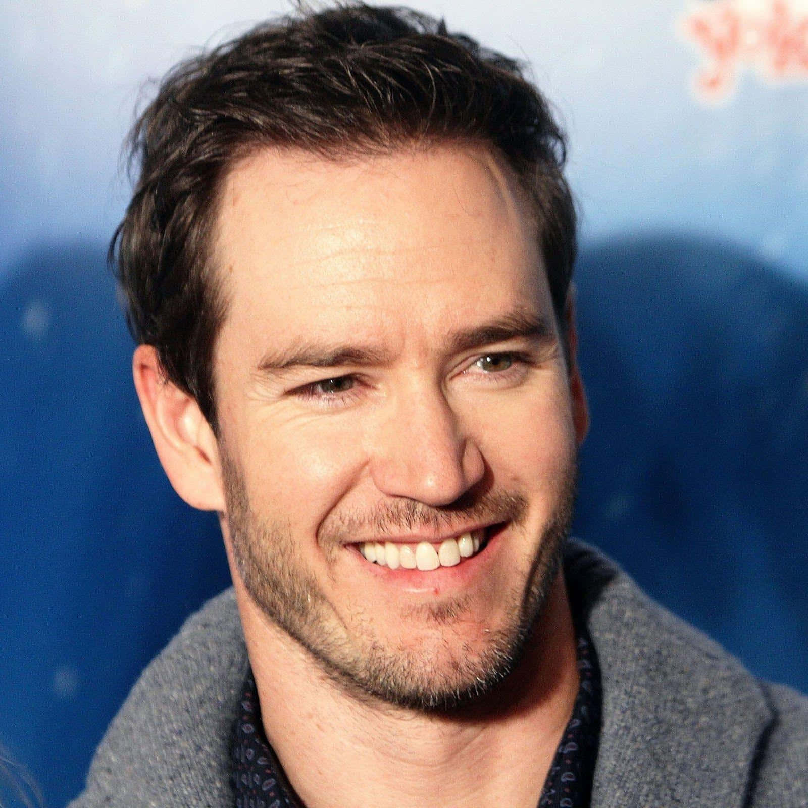 Mark-paul Gosselaar In A Blue Suit Background