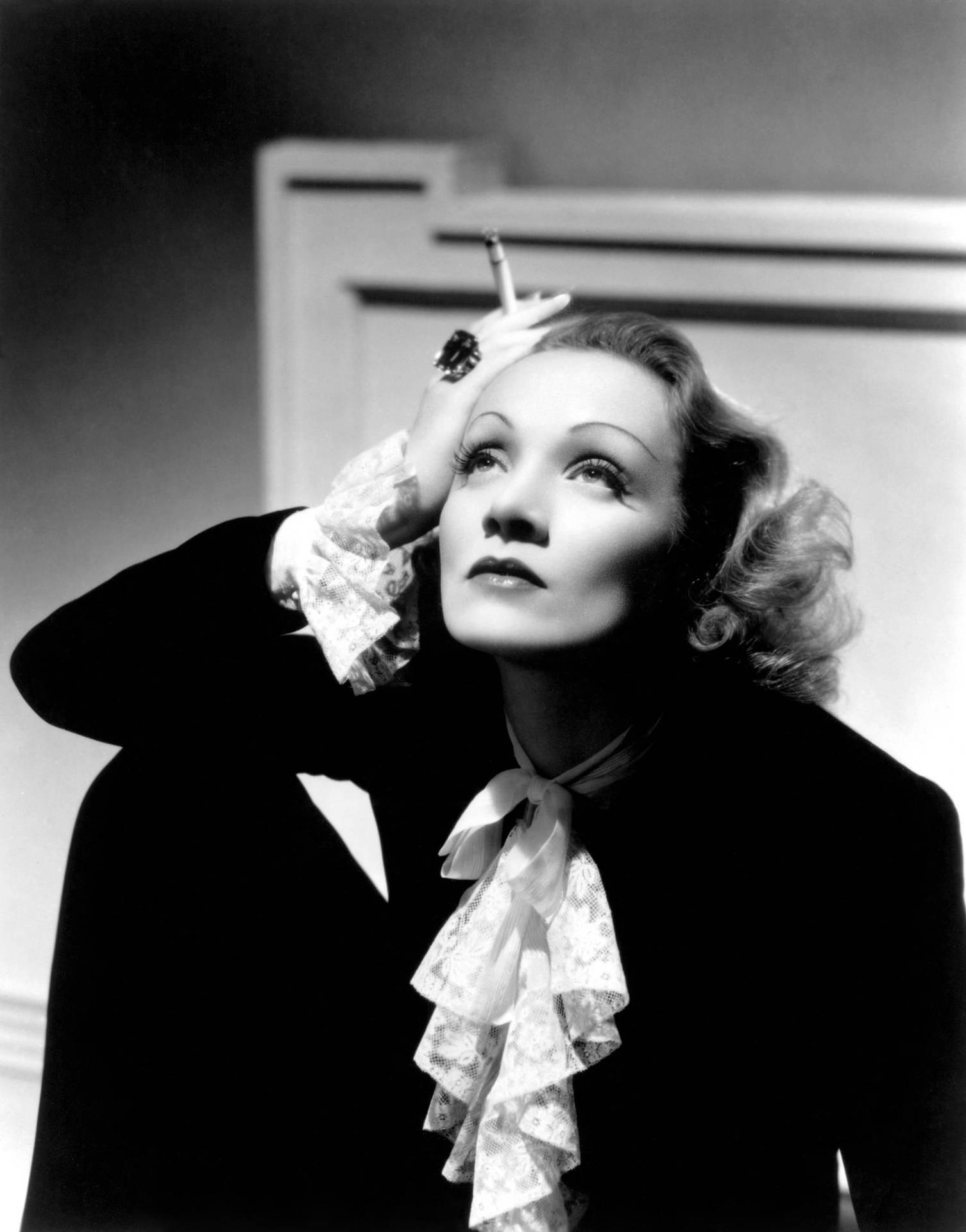 Marlene Dietrich Black Outfit And Ruffled Necktie Background