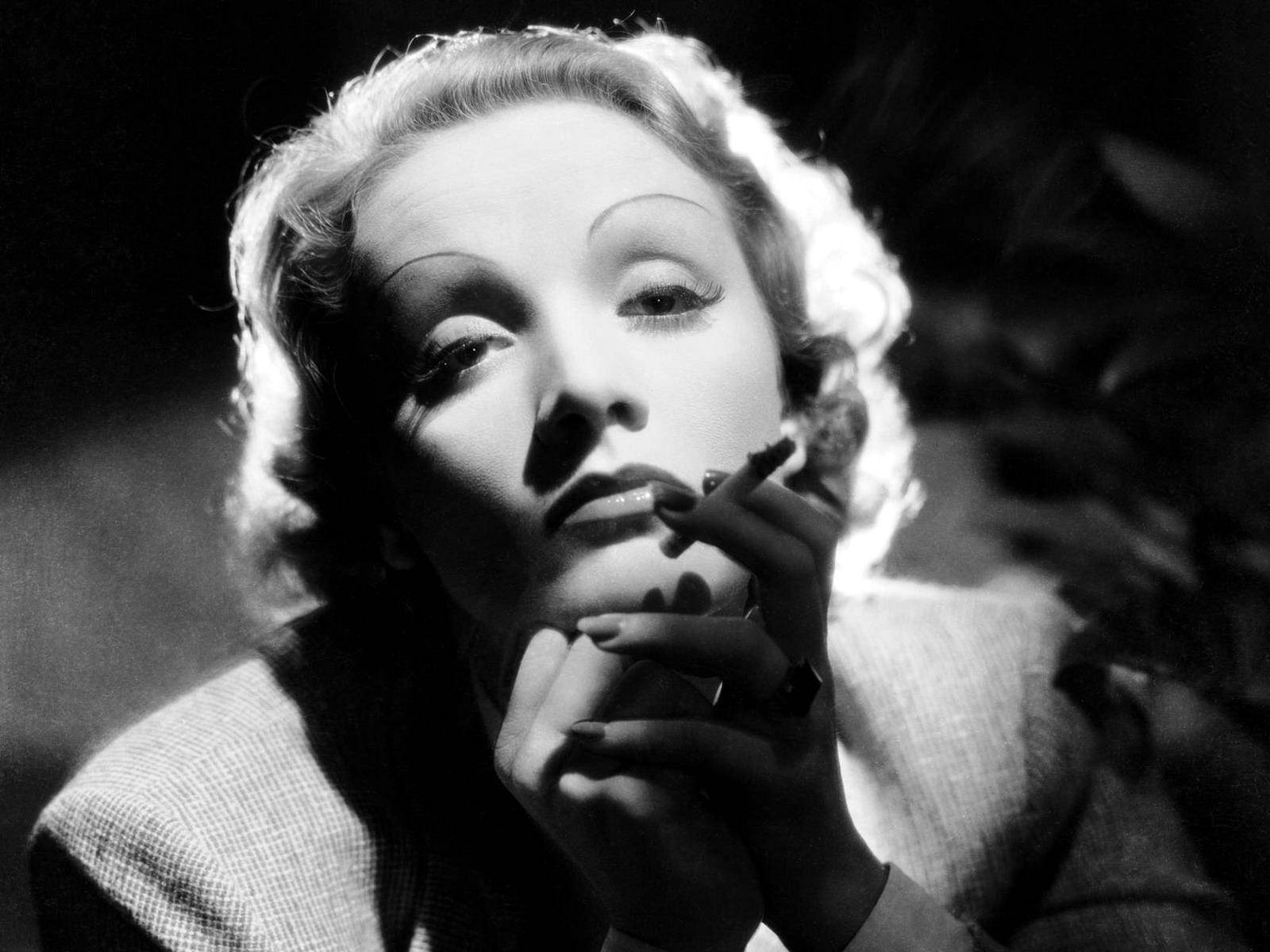 Marlene Dietrich Cigarette In Hand Background