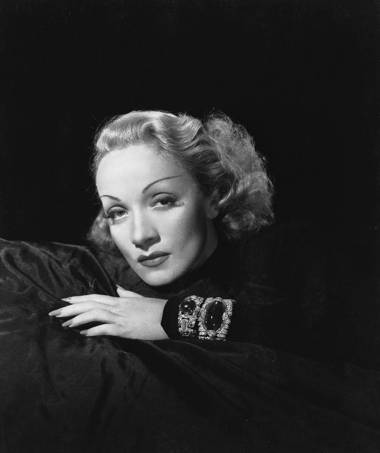 Marlene Dietrich Lying On Bed Background