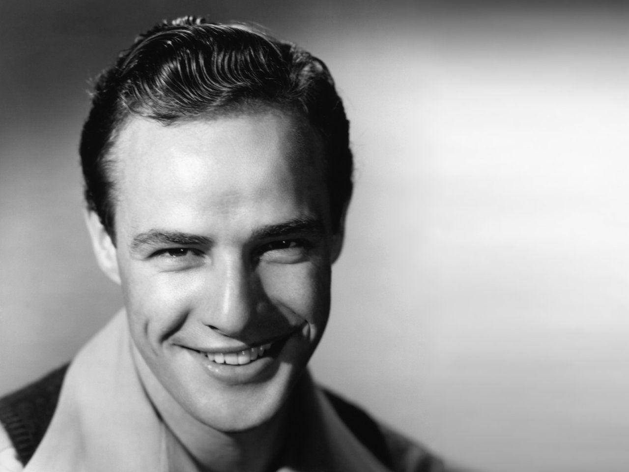 Marlon Brando Charming Smile With Dimples Background