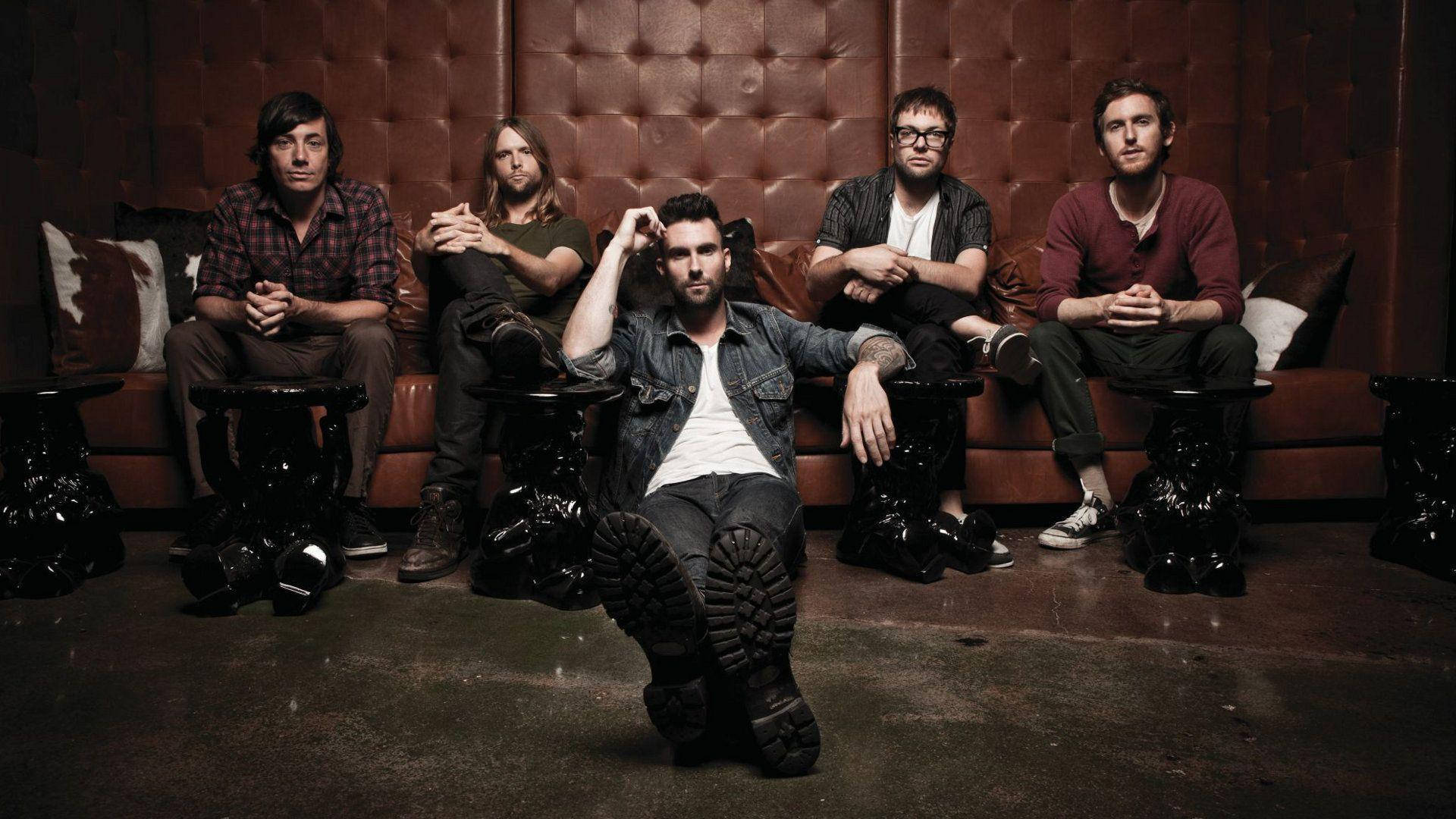 Maroon 5 Brown Leather Sofa Background