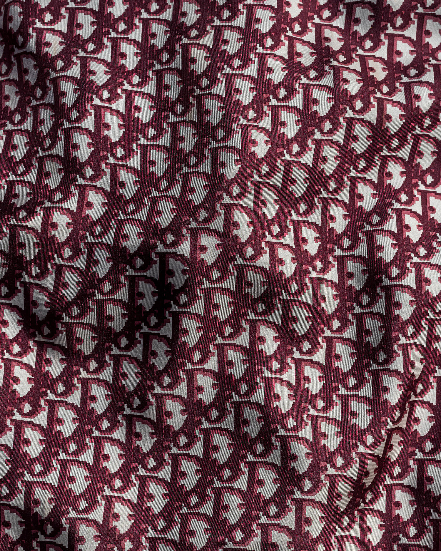 Maroon Oblique Pattern Dior Designer Logo Background