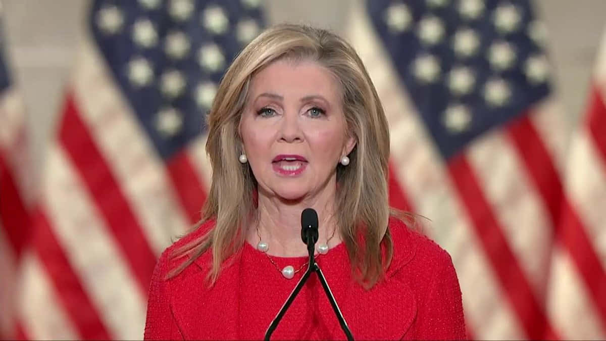 Marsha Blackburn And American Flags Background