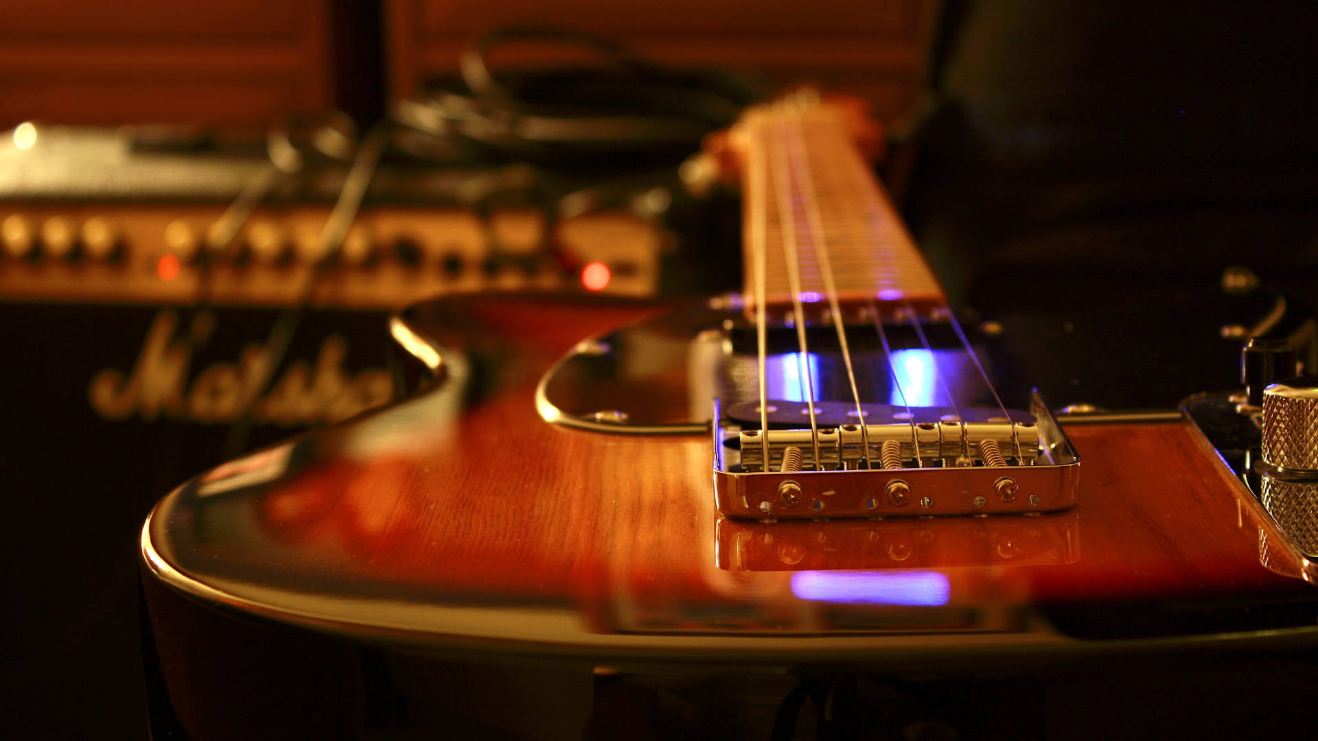 Marshall Amplifier Behind Guitar