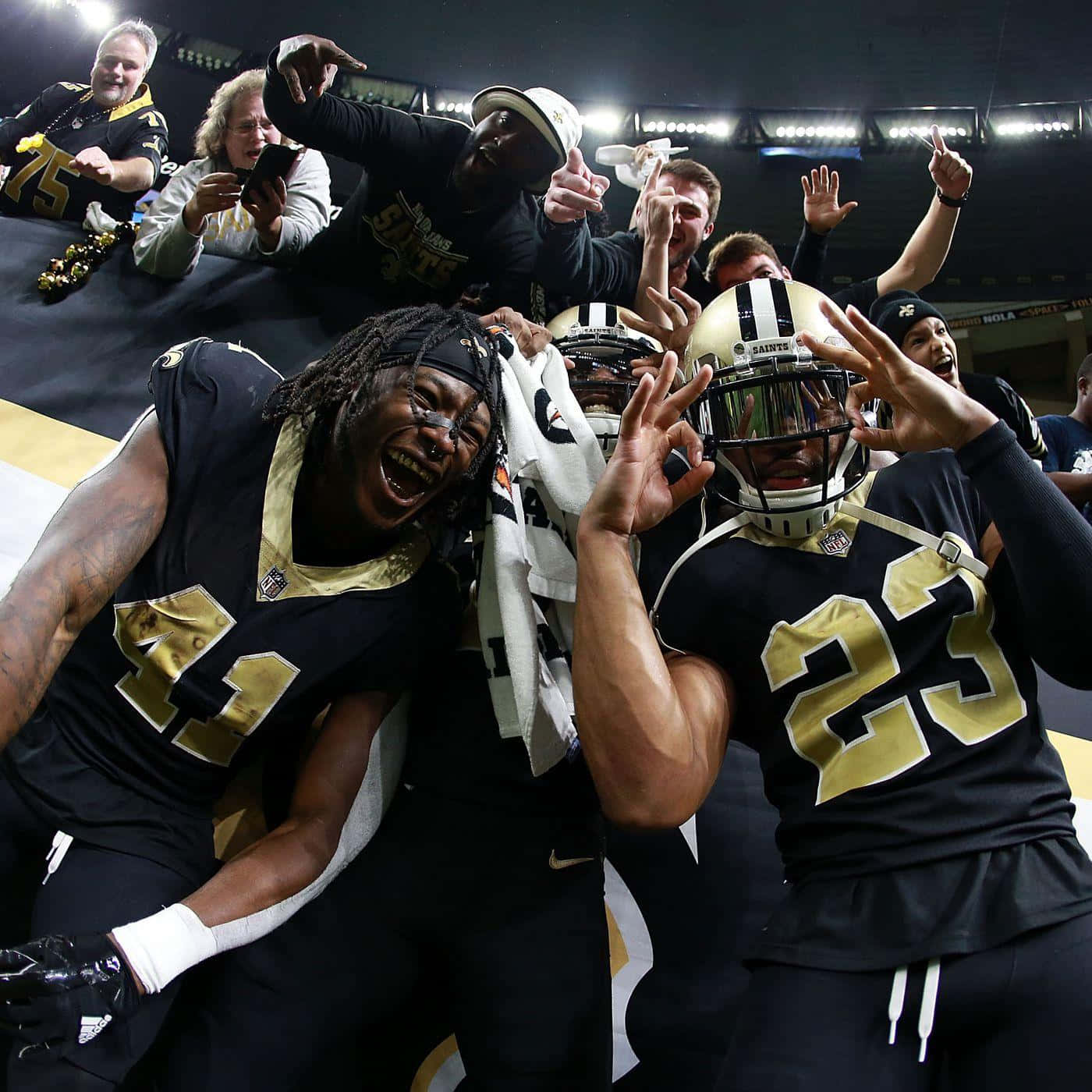 Marshon Lattimore Celebrating With His Teammates Background
