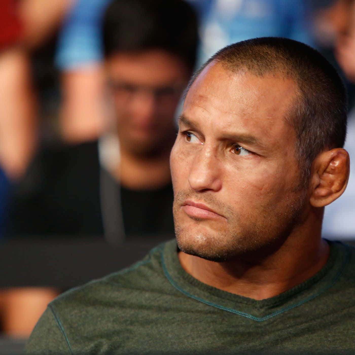 Martial Artist Dan Henderson Watching A Fight Background