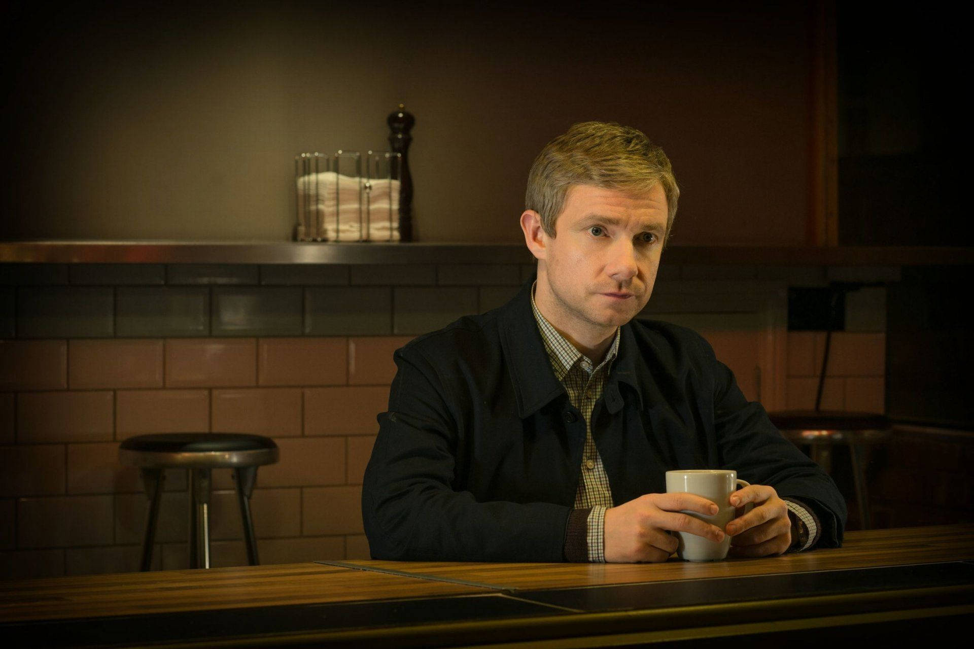 Martin Freeman Holding Cup Background