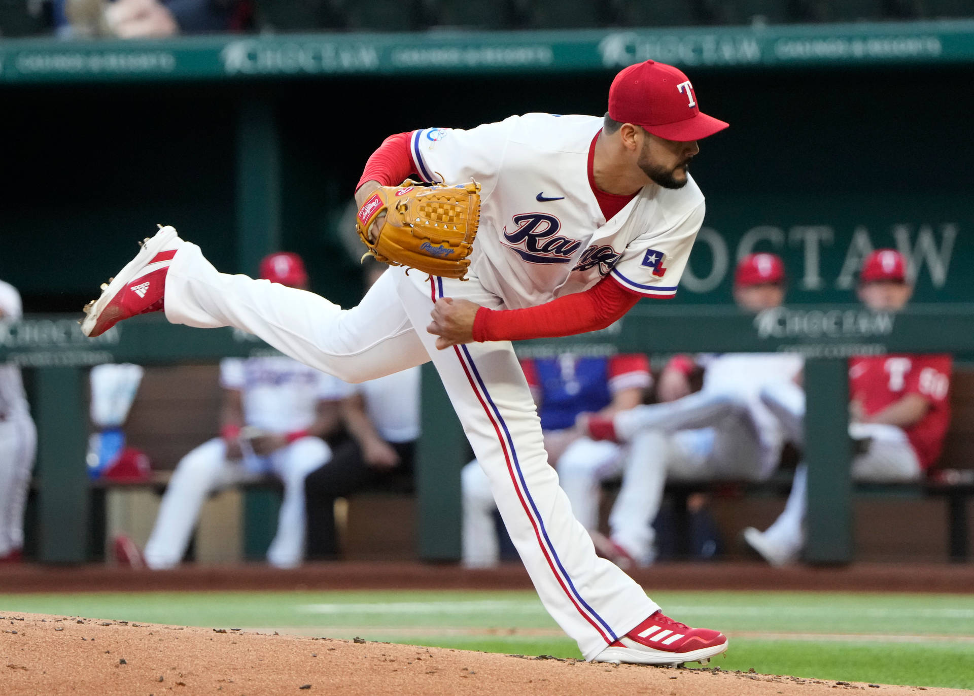 Martin Perez Mid-throw On Field Background