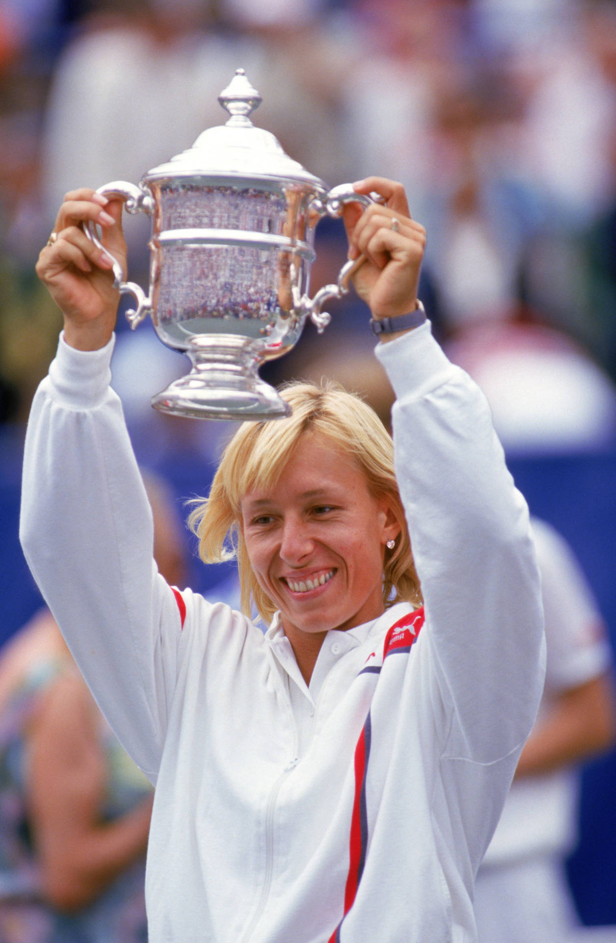 Martina Navratilova Smiling With Trophy Background