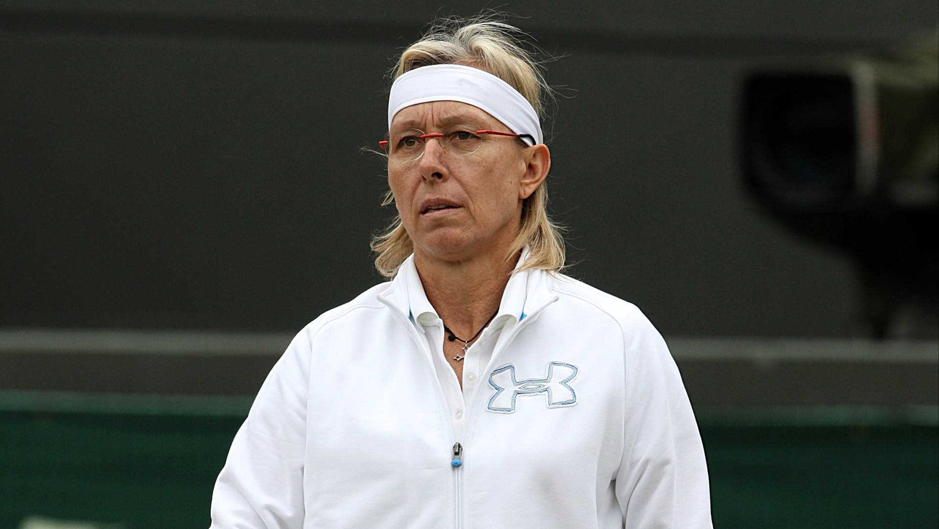 Martina Navratilova Wearing White Jacket Background