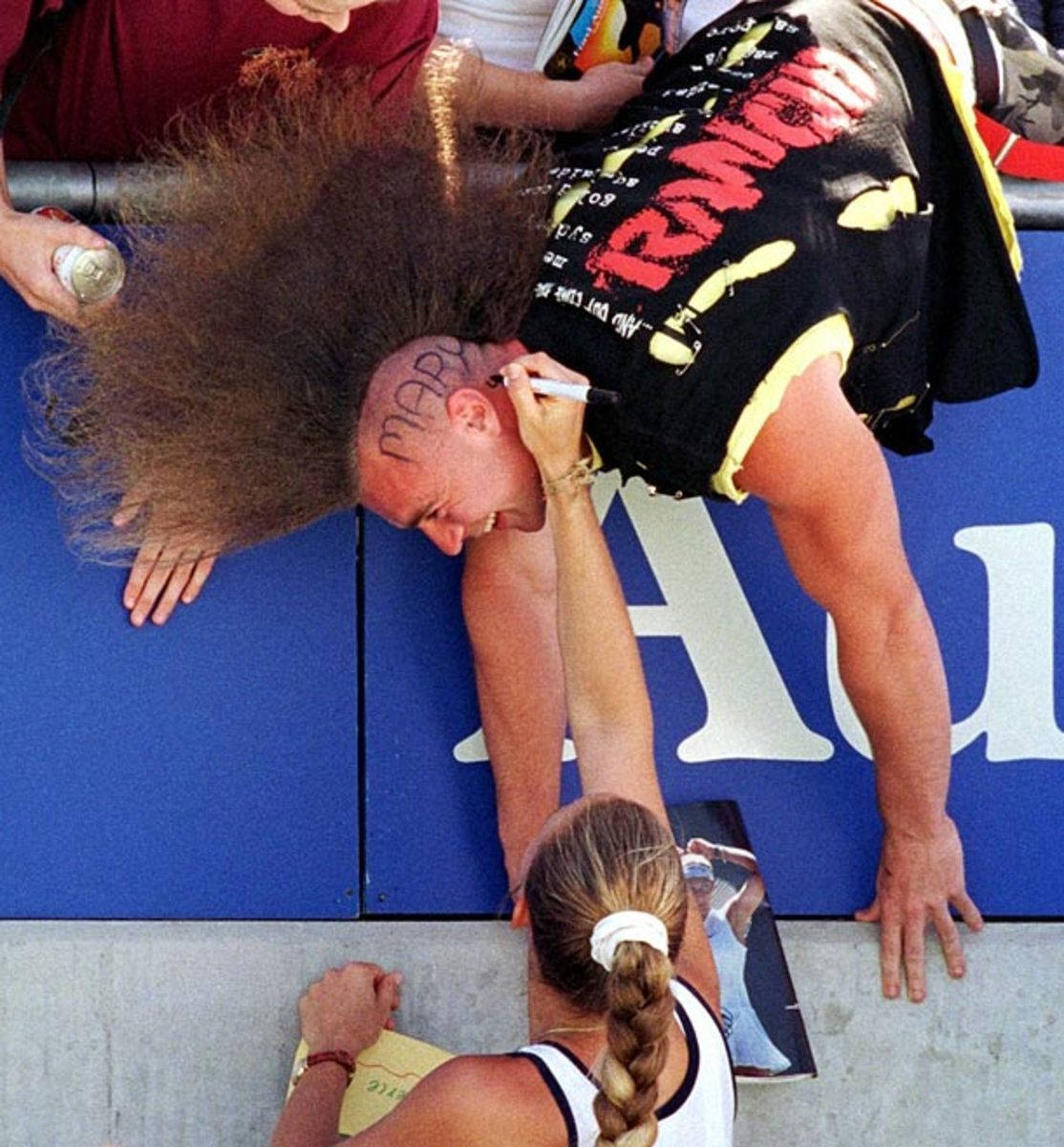 Mary Pierce Signing An Autograph For A Fan Background