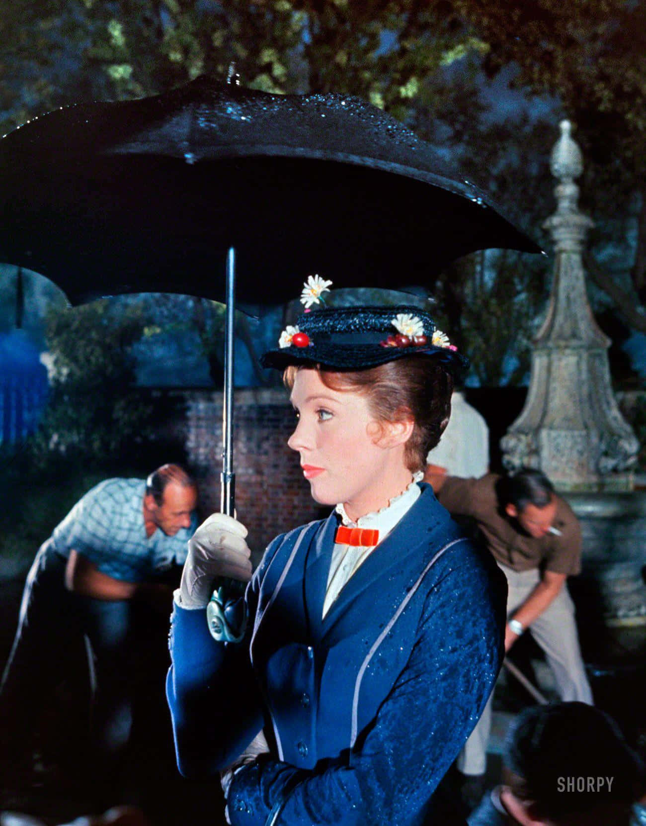Mary Poppins Soaring Through The Sky With Her Umbrella