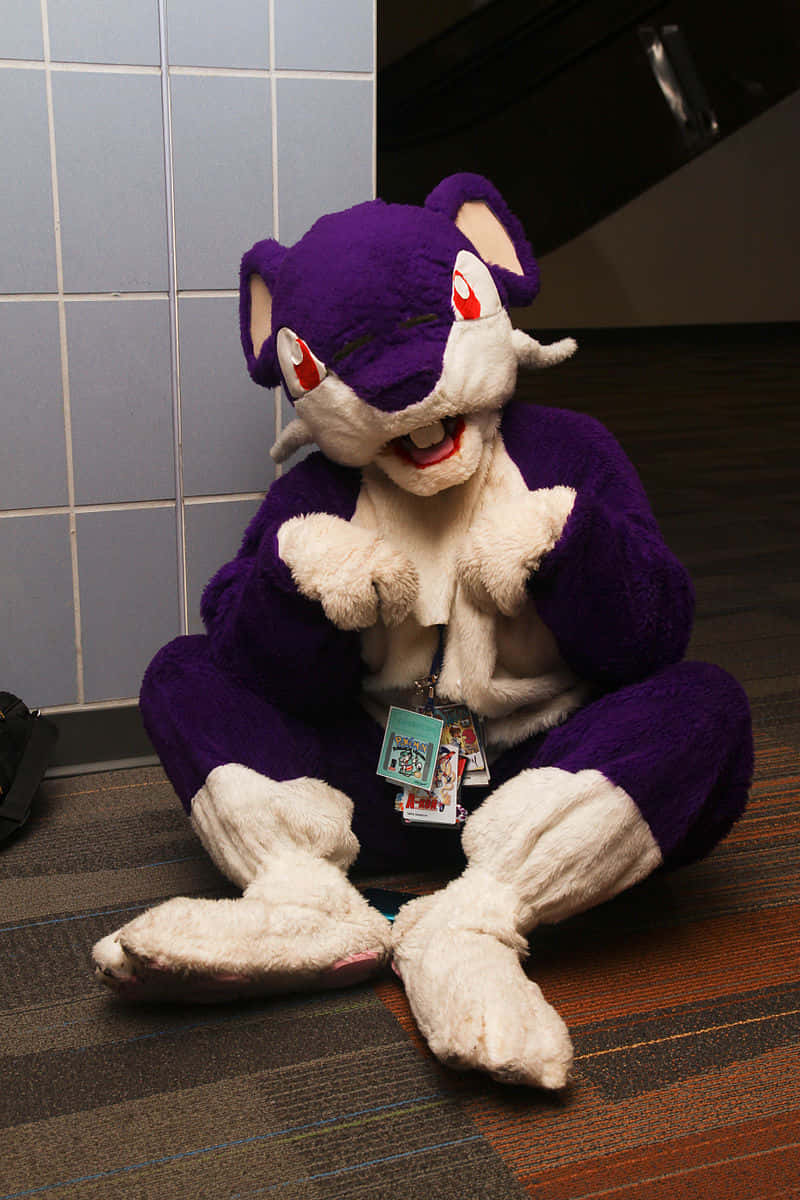 Mascot Costume Of Pokemon Rattata Sitting On A Floor