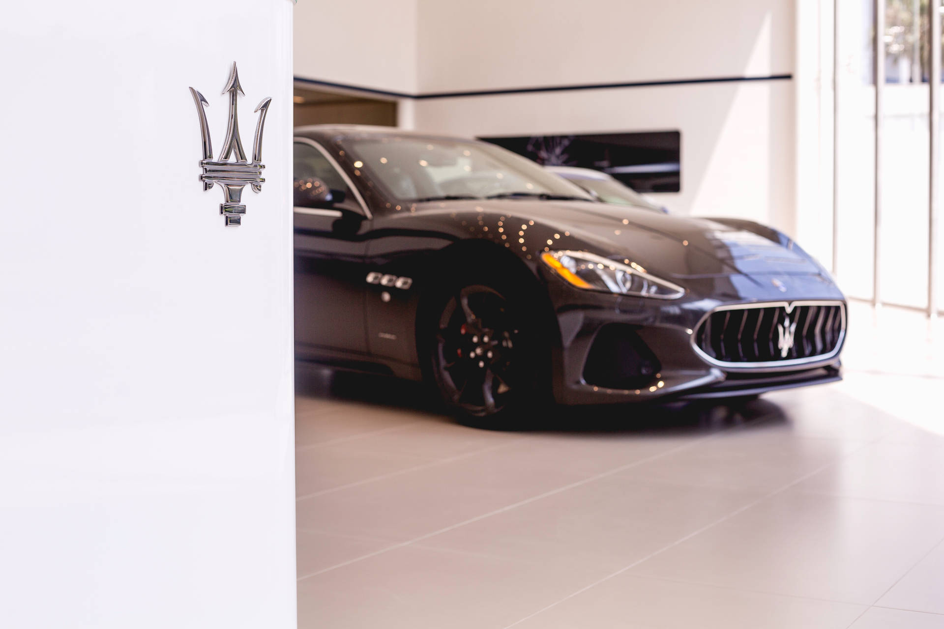 Maserati Car In Showroom Background